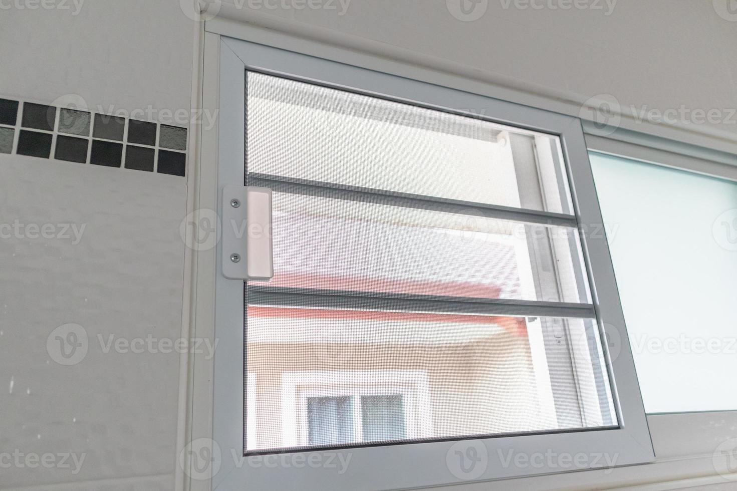 mosquito net wire screen on house window protection against insect photo