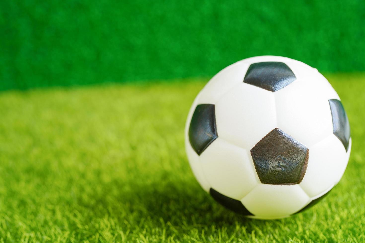 Gold bitcoin with soccer ball or football, cryptocurrency used in online sports betting. photo