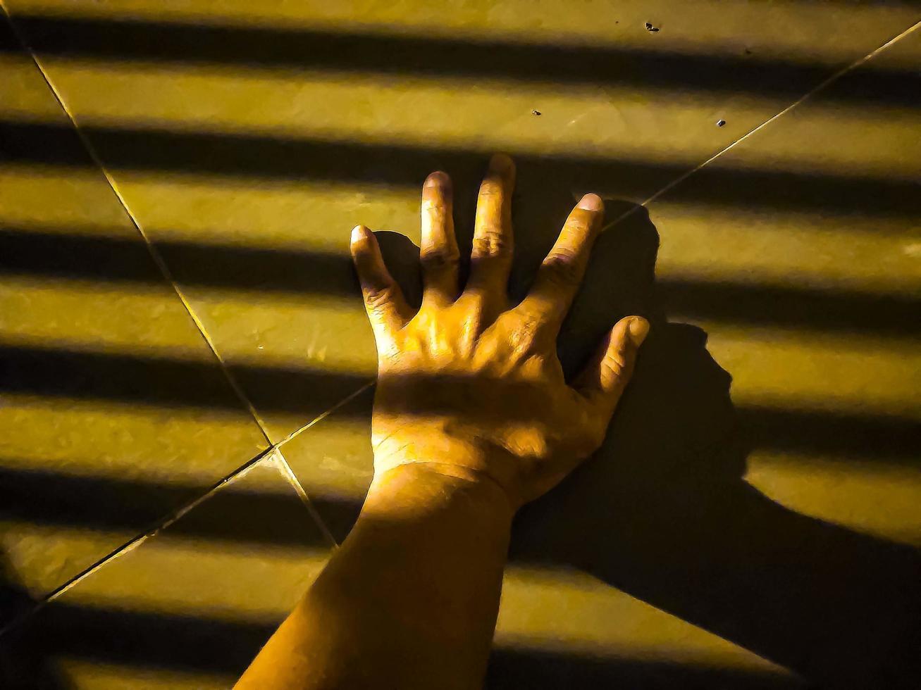 Contract stripes shadow on the hand palm photo