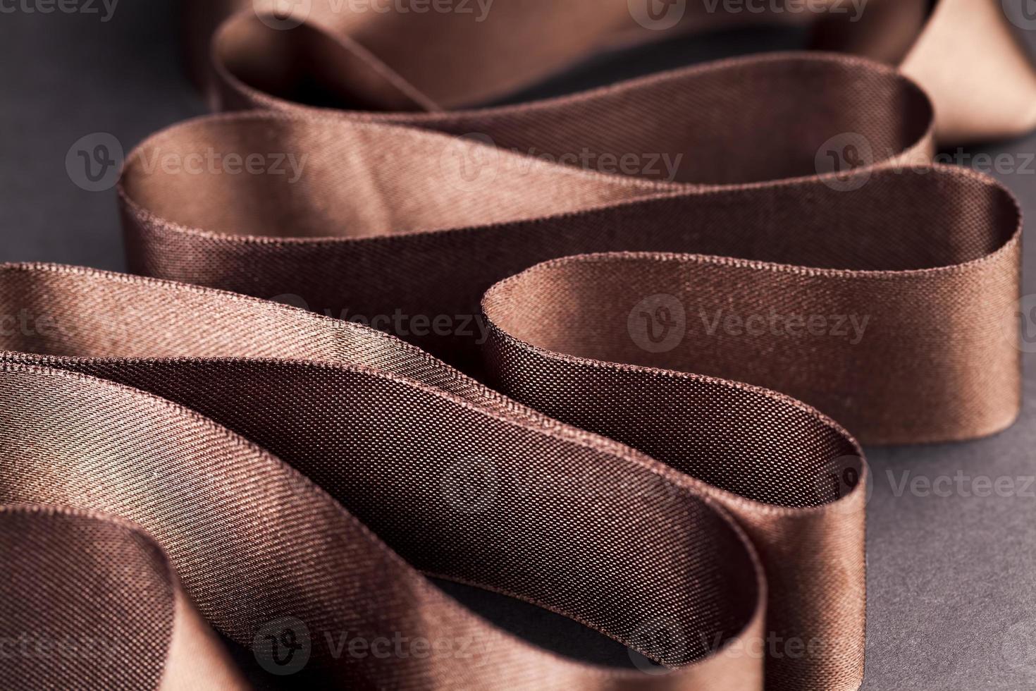brown satin ribbon for different purposes photo