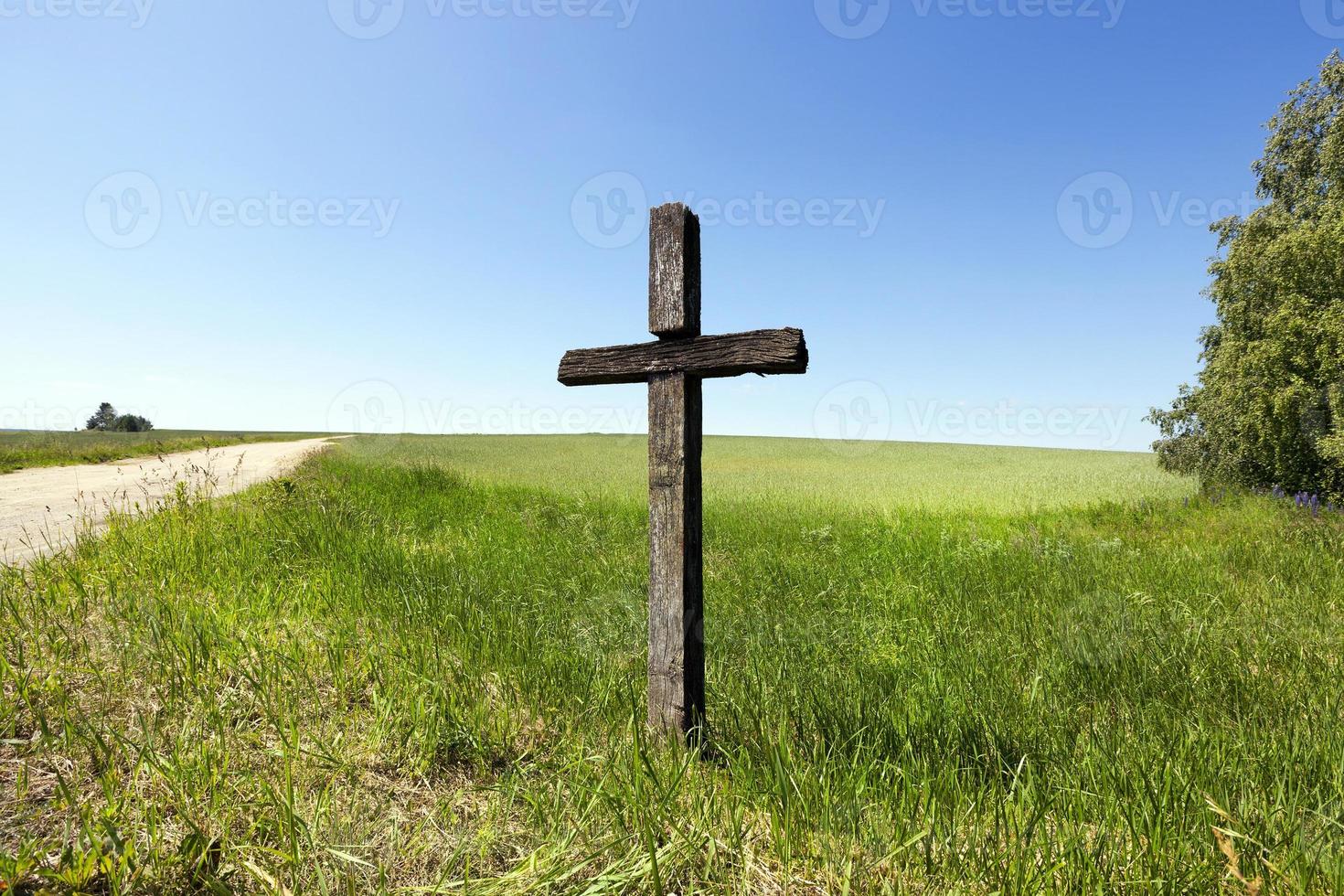 Wooden cross, close  up field photo