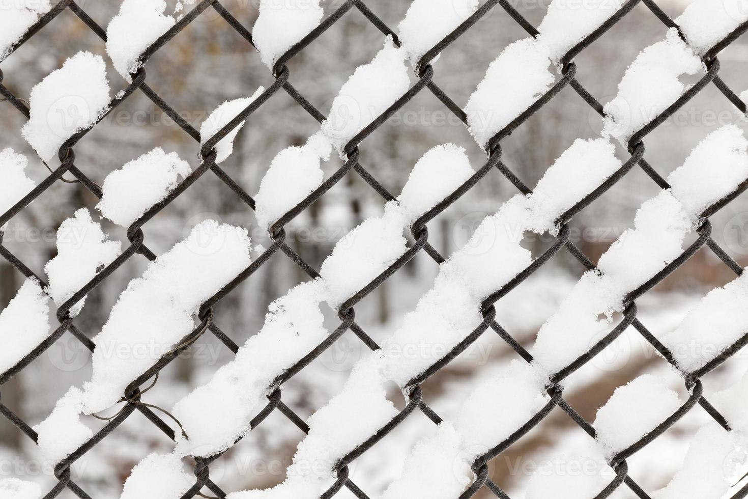 metal grating covered snow photo