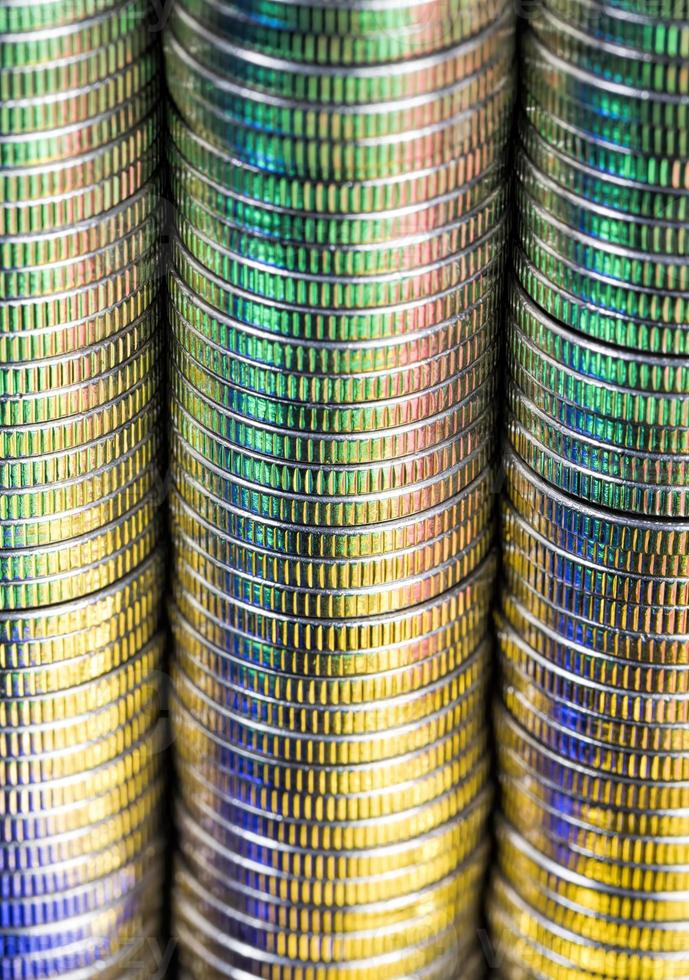 coins of silver color illuminated with yellow green color photo