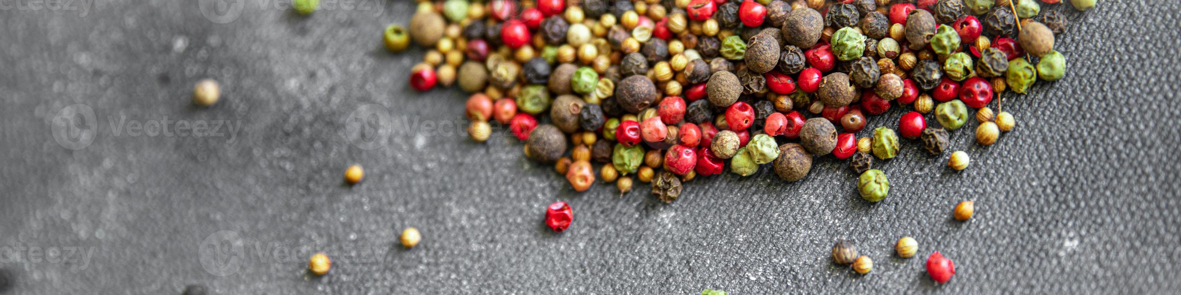 5 spices peppercorn  red, black, green and white pepper, coriander fresh healthy food snack on the table copy space food background photo