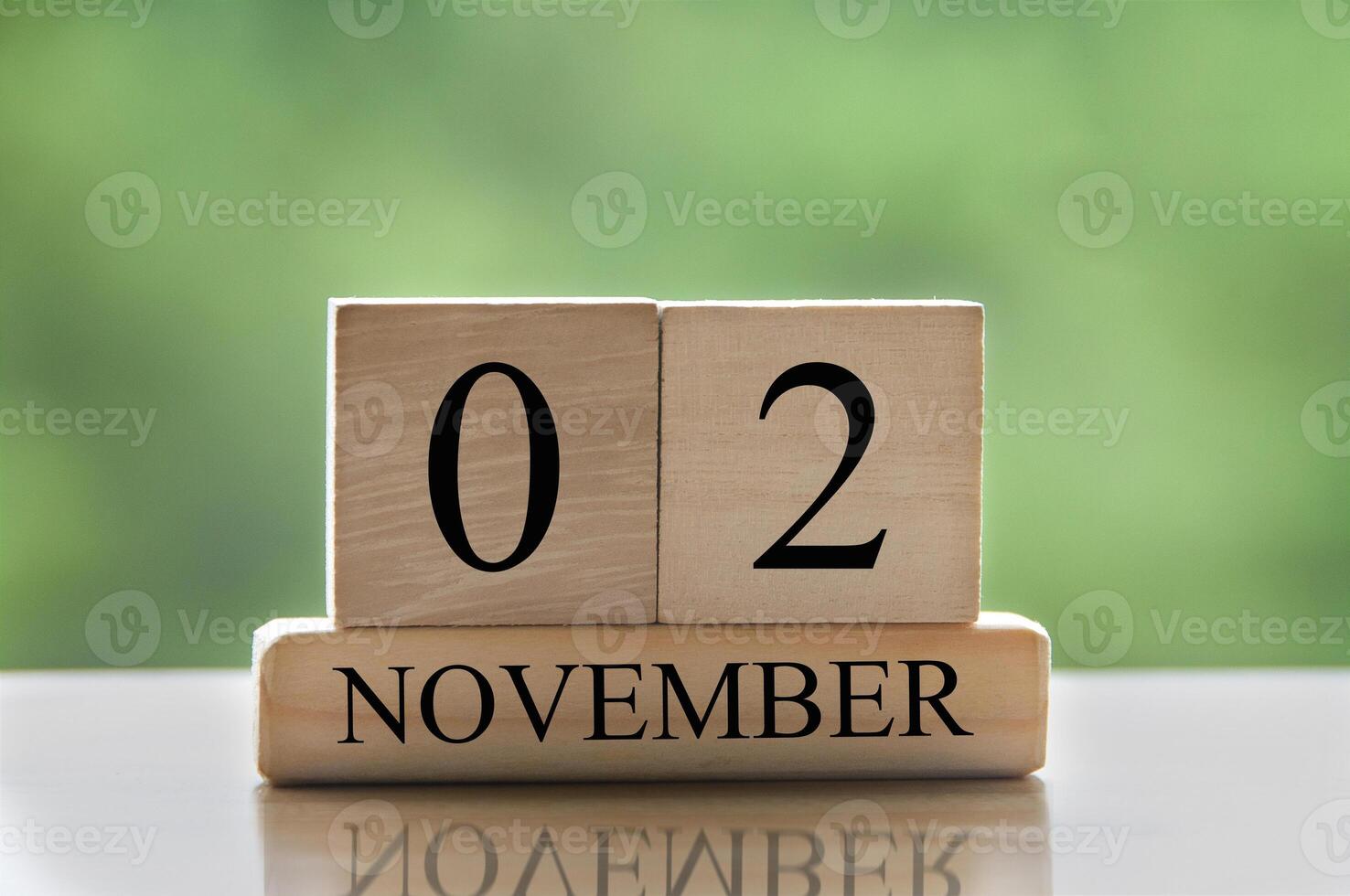 November 2 calendar date text on wooden blocks with copy space calendar concept photo