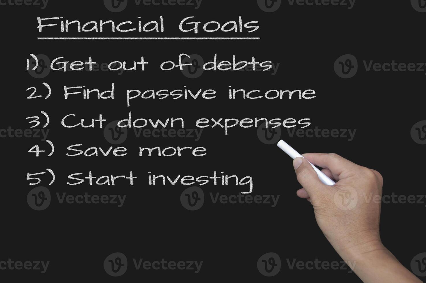 Financial goals written of blackboard. Business and financial planning concept. photo