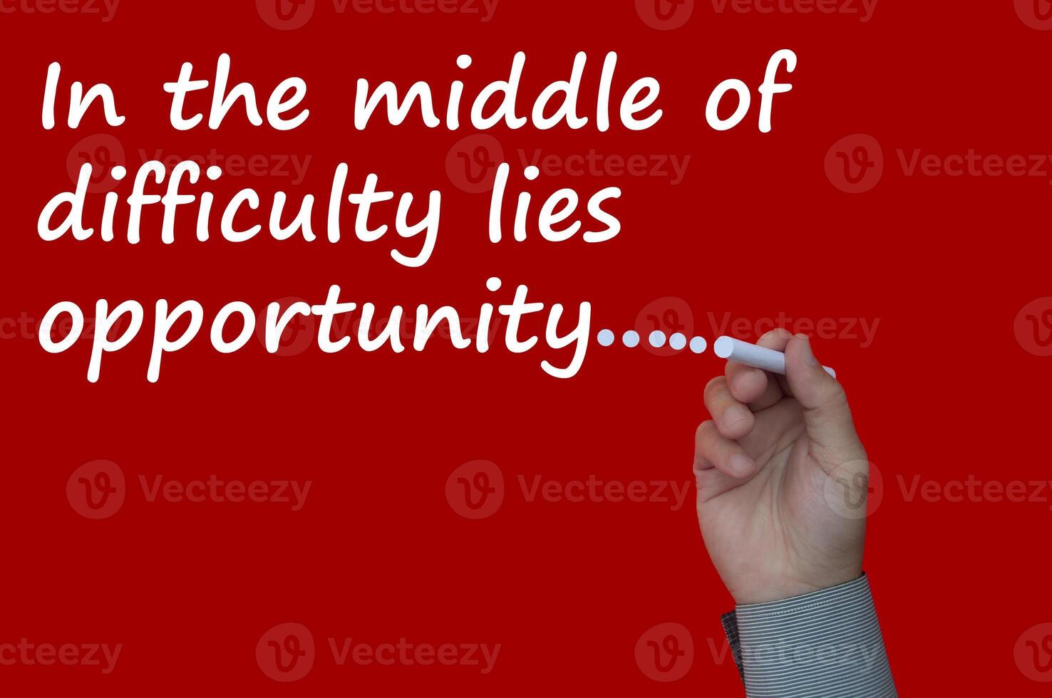 In the middle of difficulty lies opportunity text on red cover
