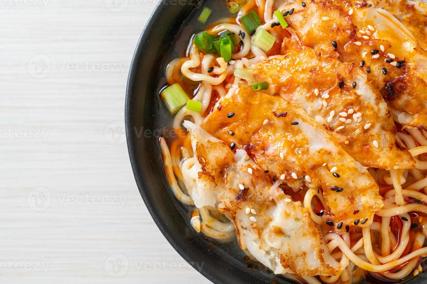 ramen noodles with gyoza or pork dumplings photo