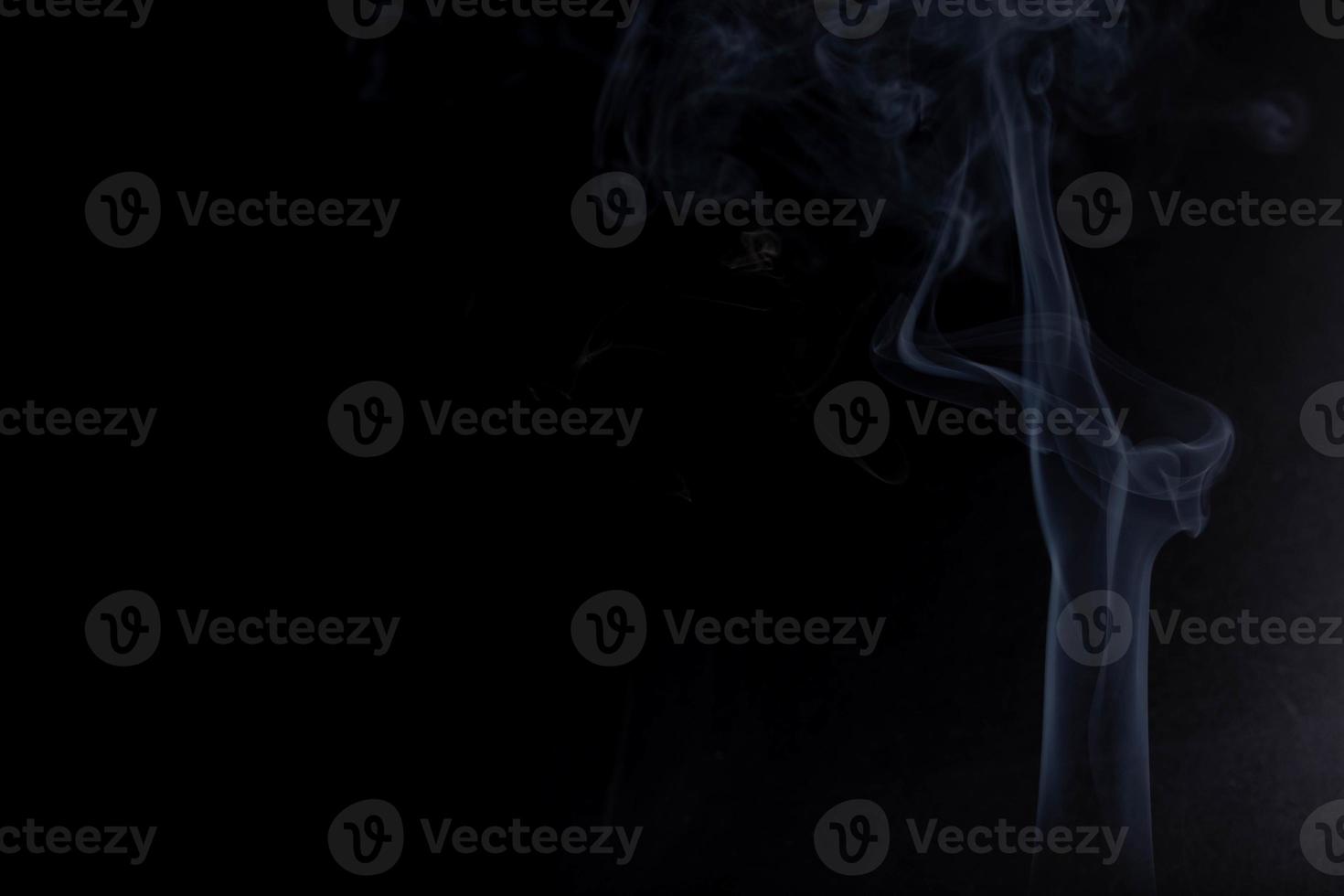 white smoke on a black background photo