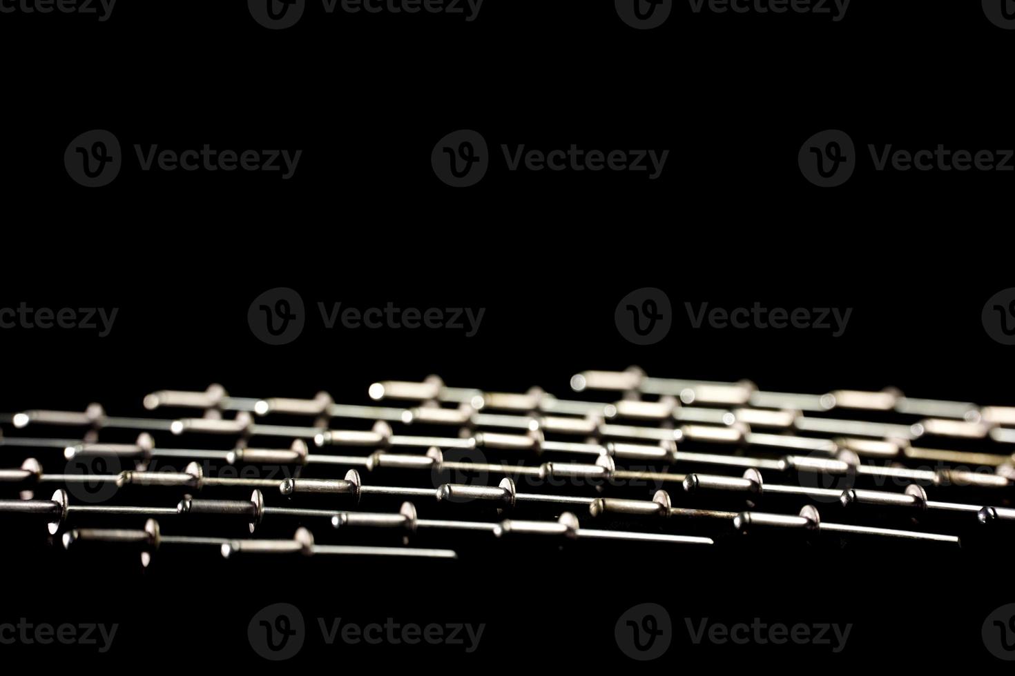 rivet nails on black background 9545096 Stock Photo at Vecteezy