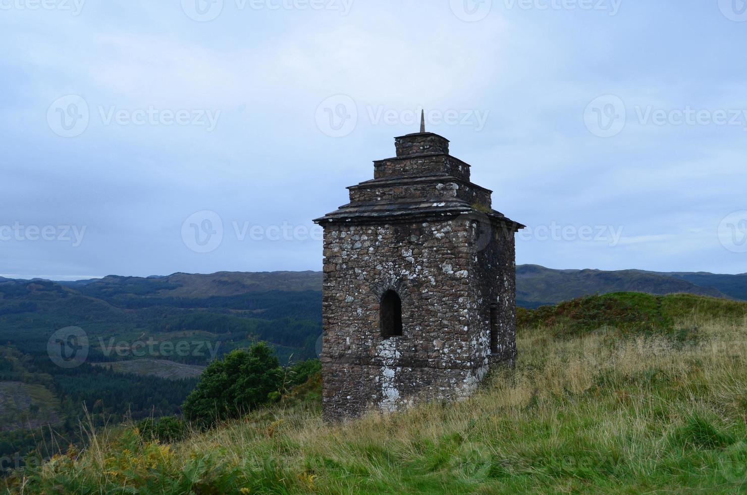 Beautiful lookout tower on a hill in scotland photo