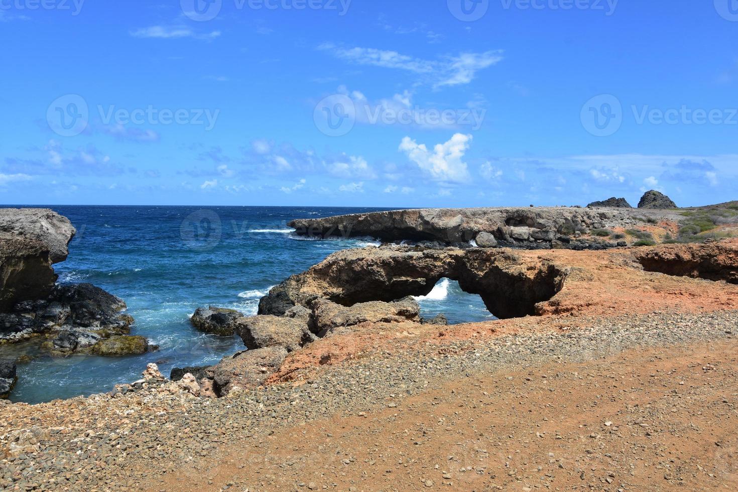 Rugged Rural Coast with a Natural Bridge in Aruba photo