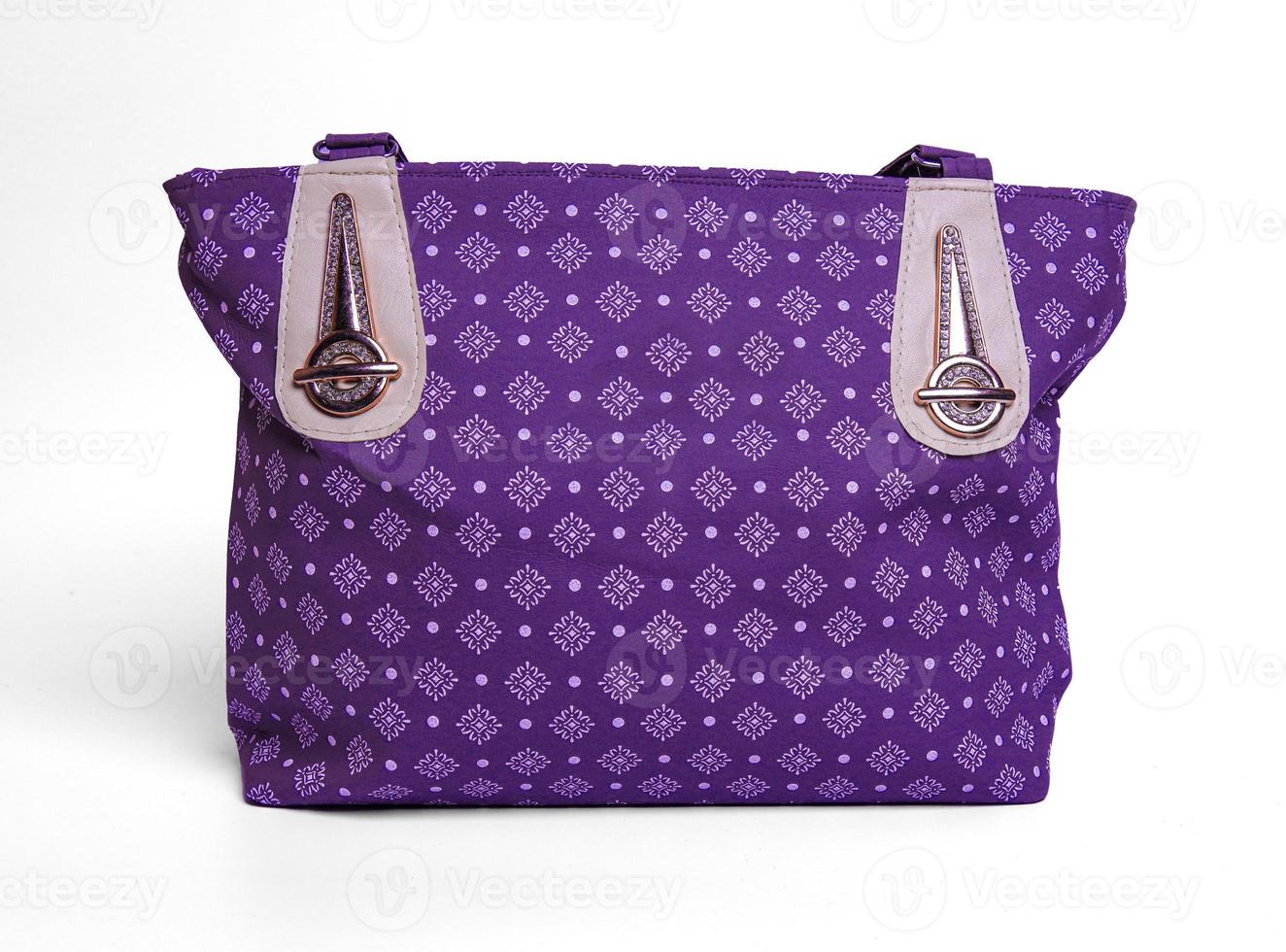 Purple fashion woman handbag with pattern design isolated on white back photo