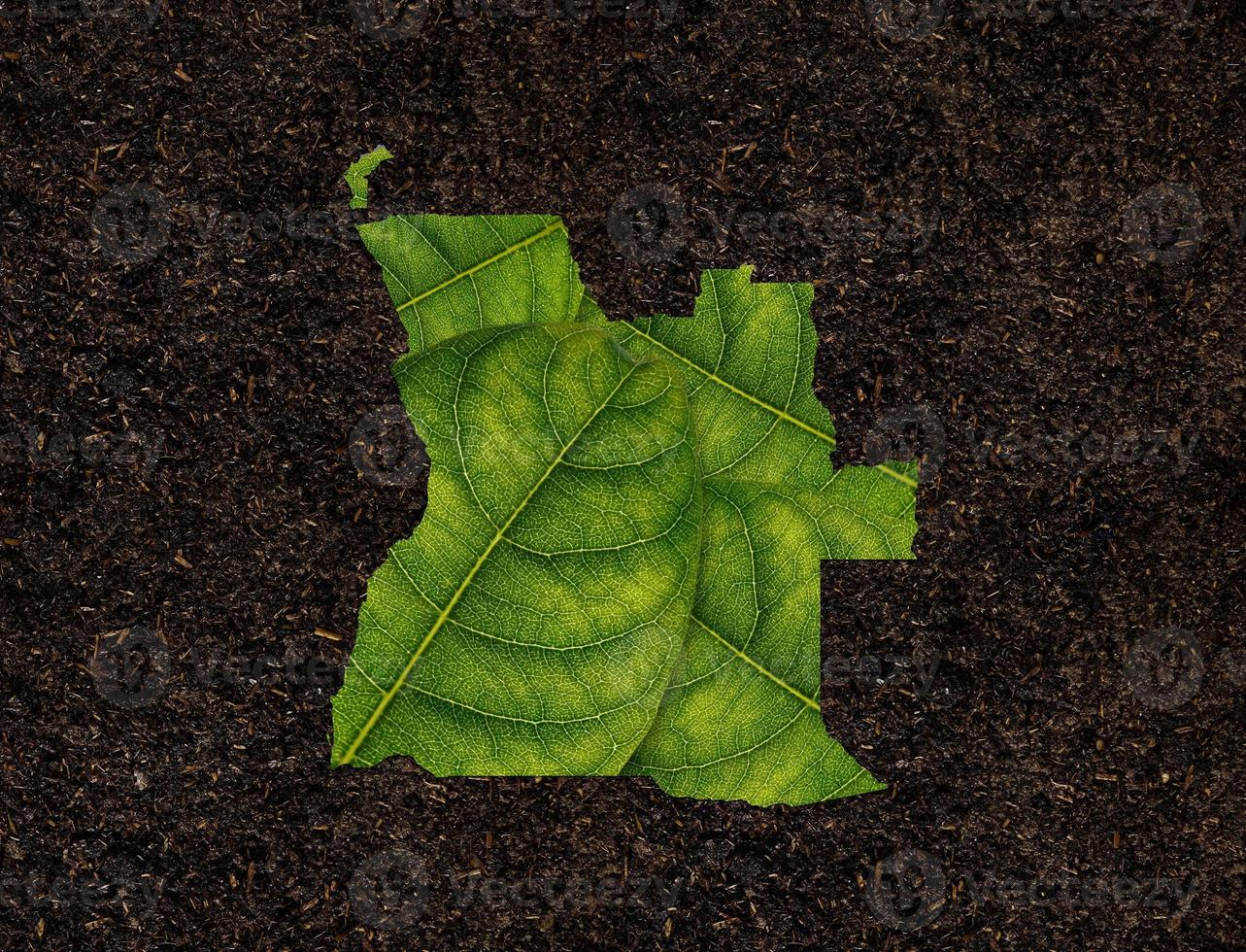 Angola map made of green leaves, concept ecology Map green leaf on soil background photo