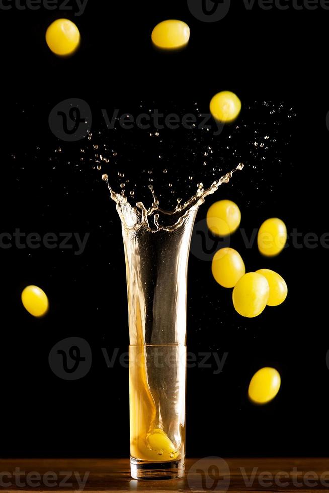 Fine wine and grapes falling photo