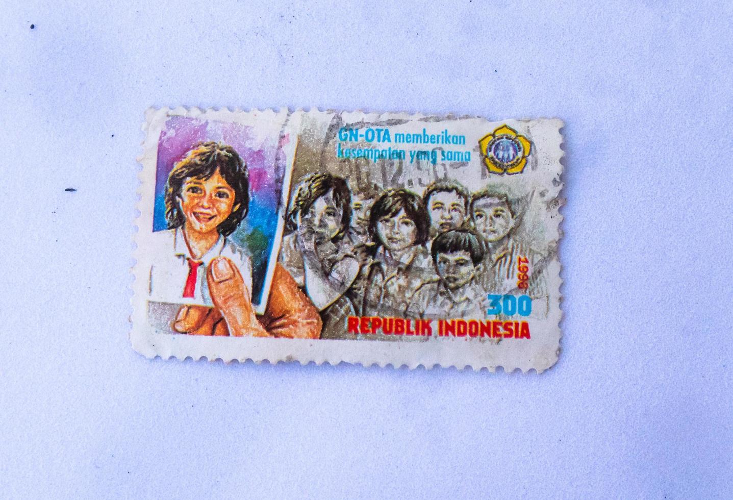 Sidoarjo, Jawa timur, Indonesia, 2022 - Close-up photo of old school stamps with isolated schoolchildren