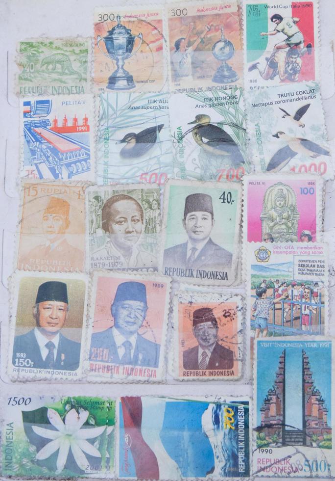 Sidoarjo, Jawa timur, Indonesia, 2022 - close-up photos of the old archipelago stamps packed in one book