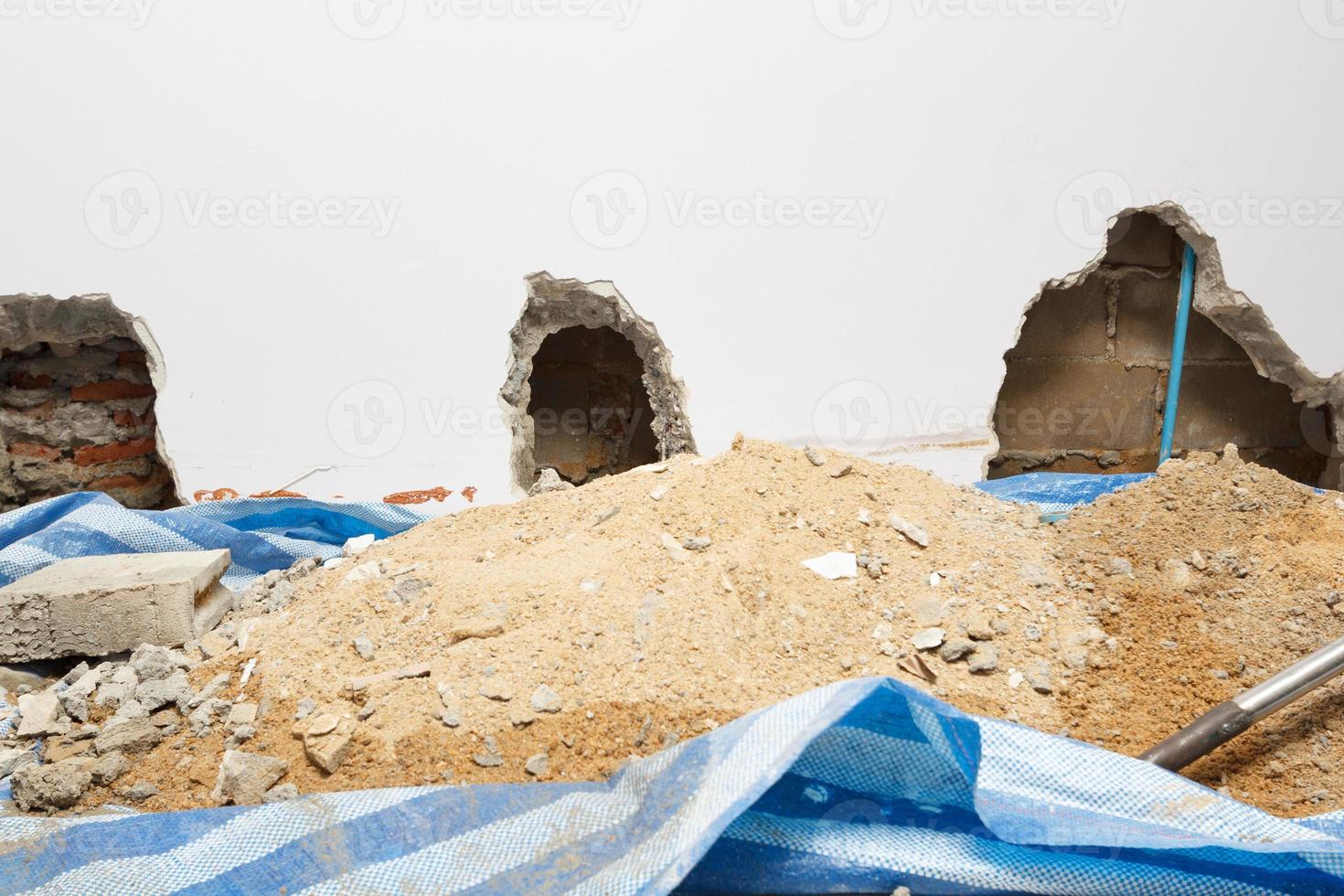 Concrete walls in the shade that have been smashed or destroyed to find holes for water leaks. Home repair concept. photo