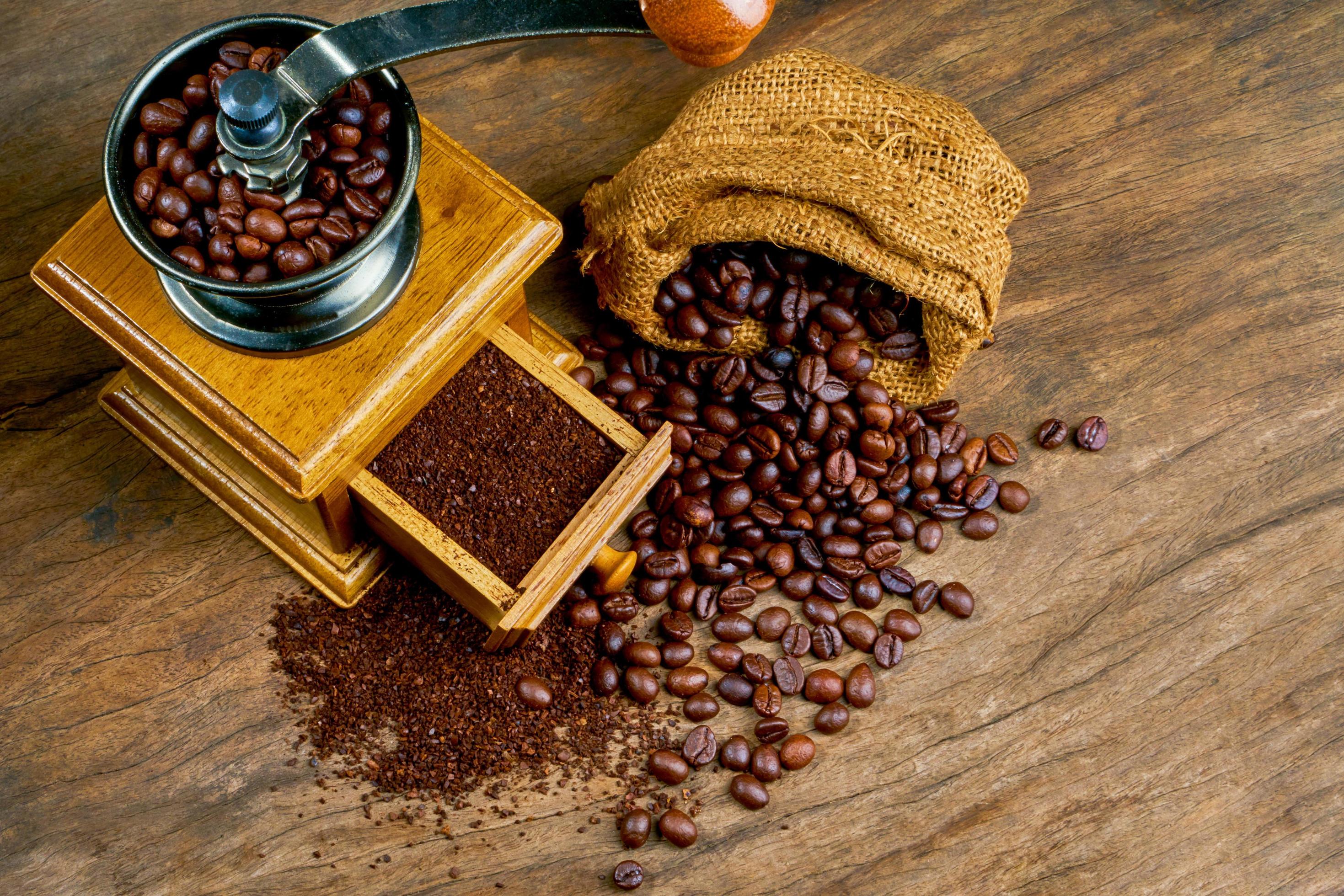 Vintage coffee grinder.Old retro hand-operated wooden and metal