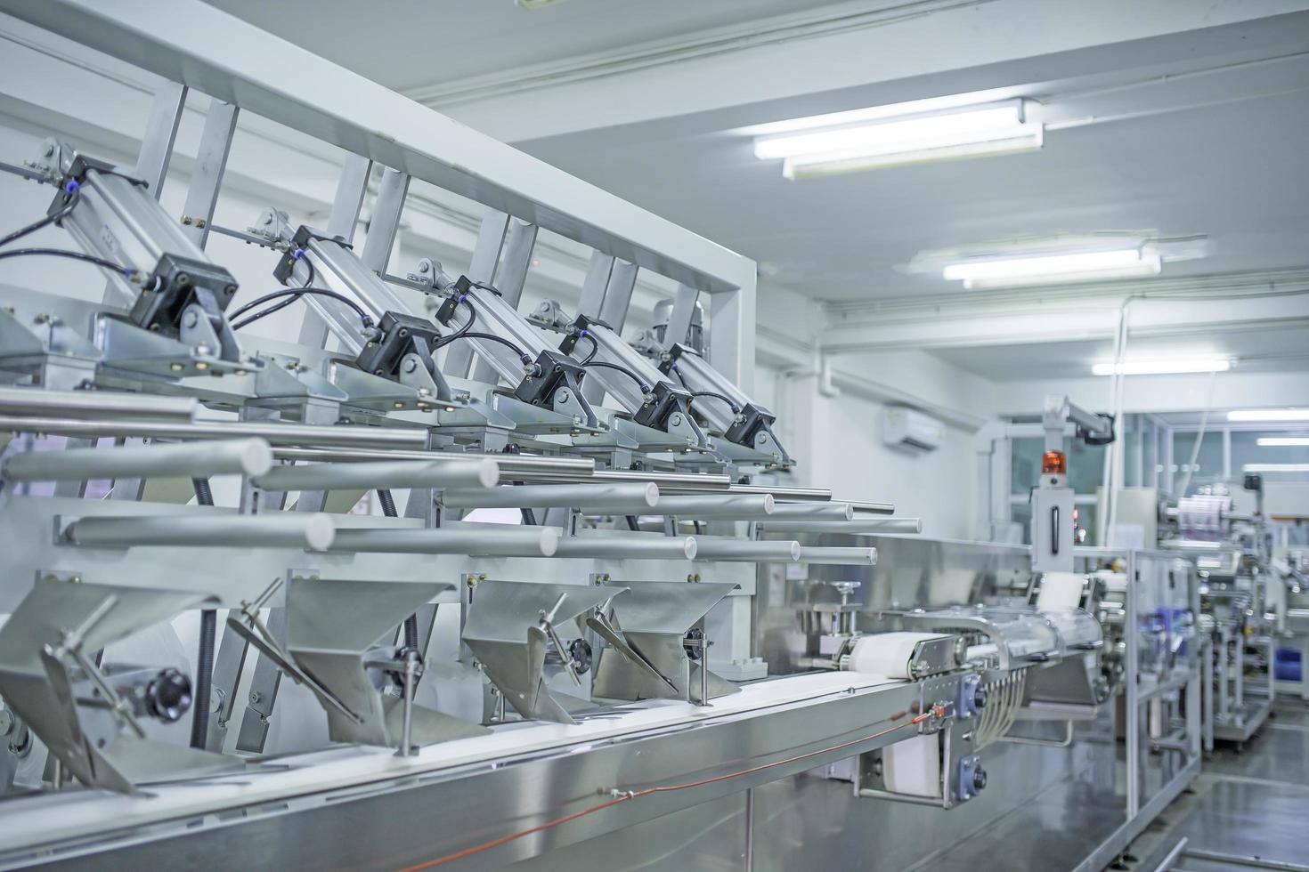 factory, industrial area, automation, technology, Machines for packing products Within the factory, sterile beauty industry in order to maintain maximum cleanliness.shallow focus effect. soft focus. photo