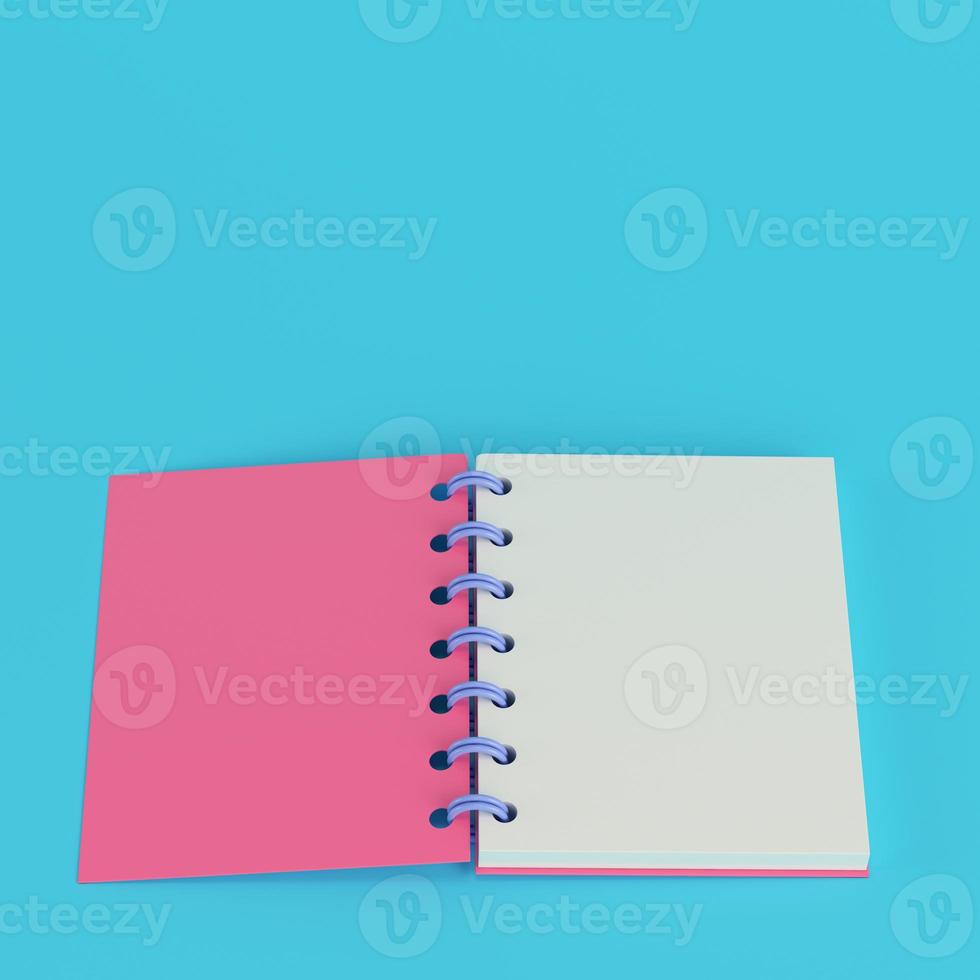 Pink notepad on bright blue background in pastel colors photo