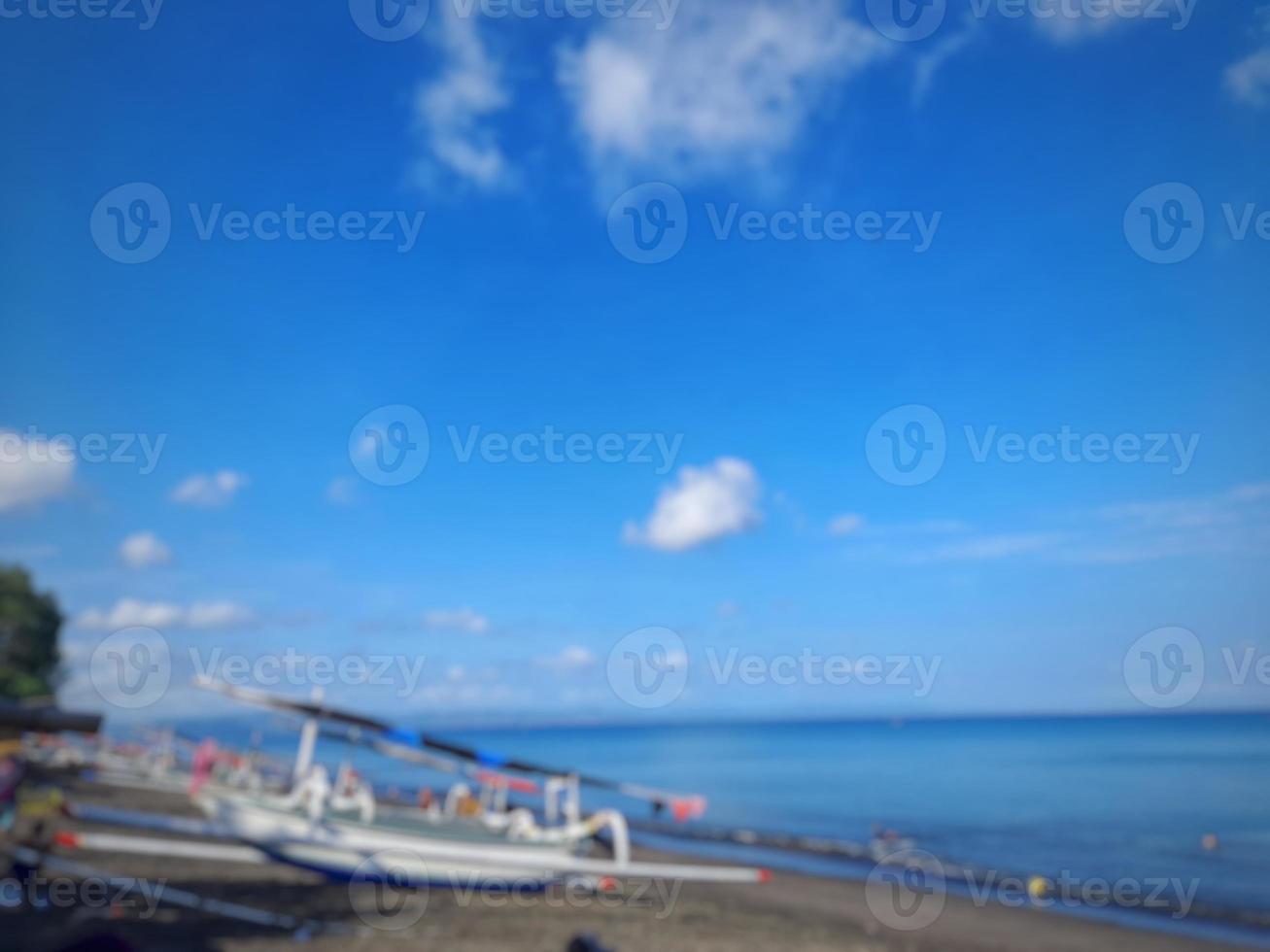 defocused abstract background of beach with clear blue sky on the island of Lombok, Indonesia photo
