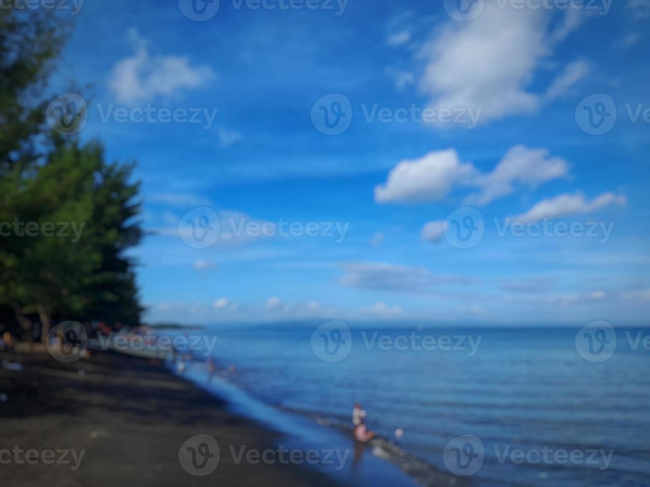 defocused abstract background of beach with clear blue sky on the island of Lombok, Indonesia photo