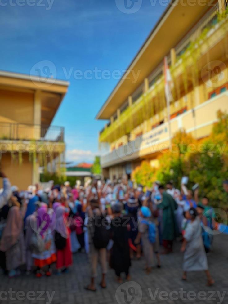 Defocused abstract background the atmosphere of students gathering in the schoolyard photo