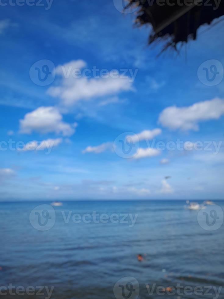 defocused abstract background of beach with clear blue sky on the island of Lombok, Indonesia photo