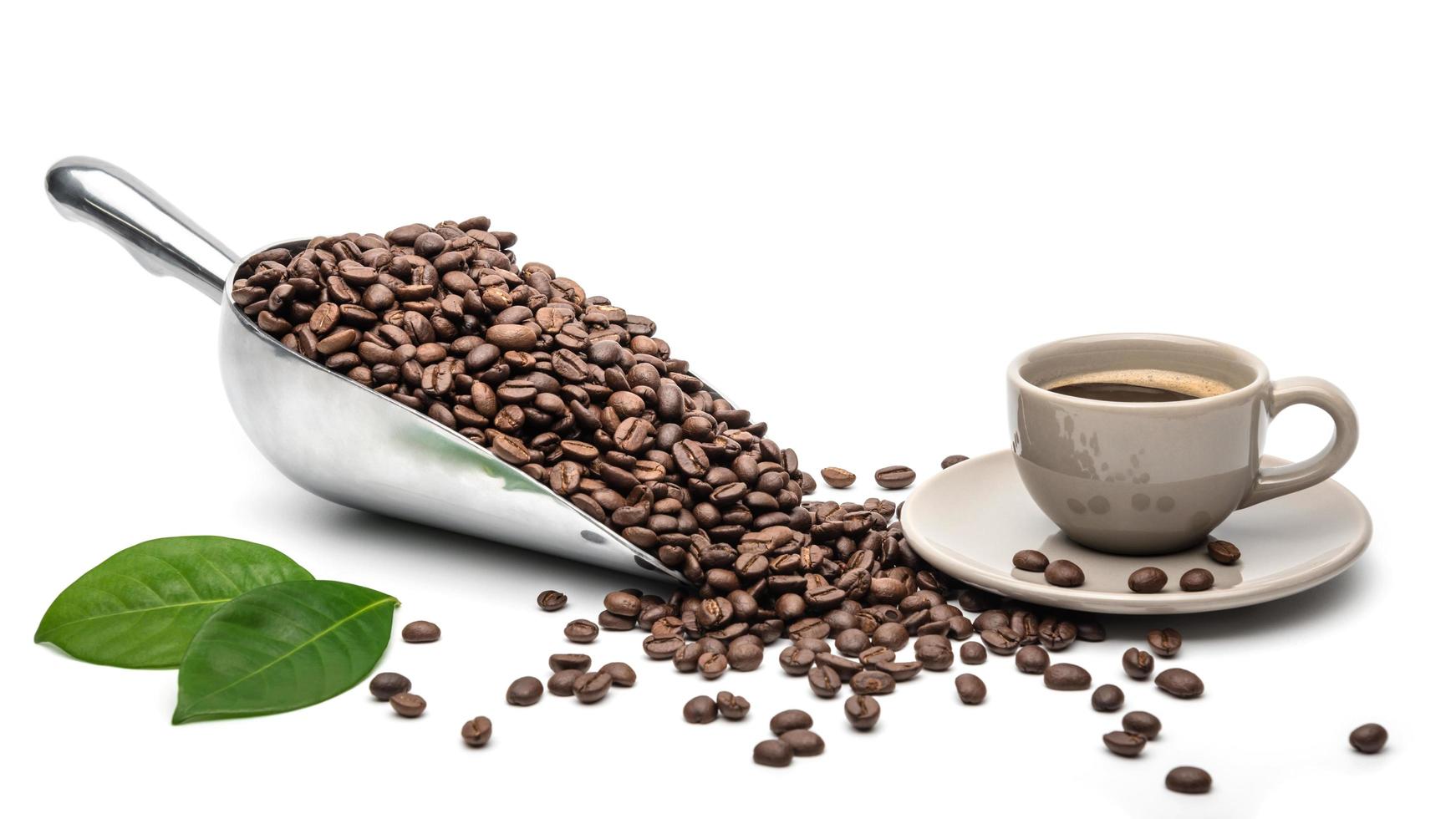 Hot coffee cup with Spoon Coffee scoop and coffee beans on a white background, copy space for your text. Coffee Espresso photo