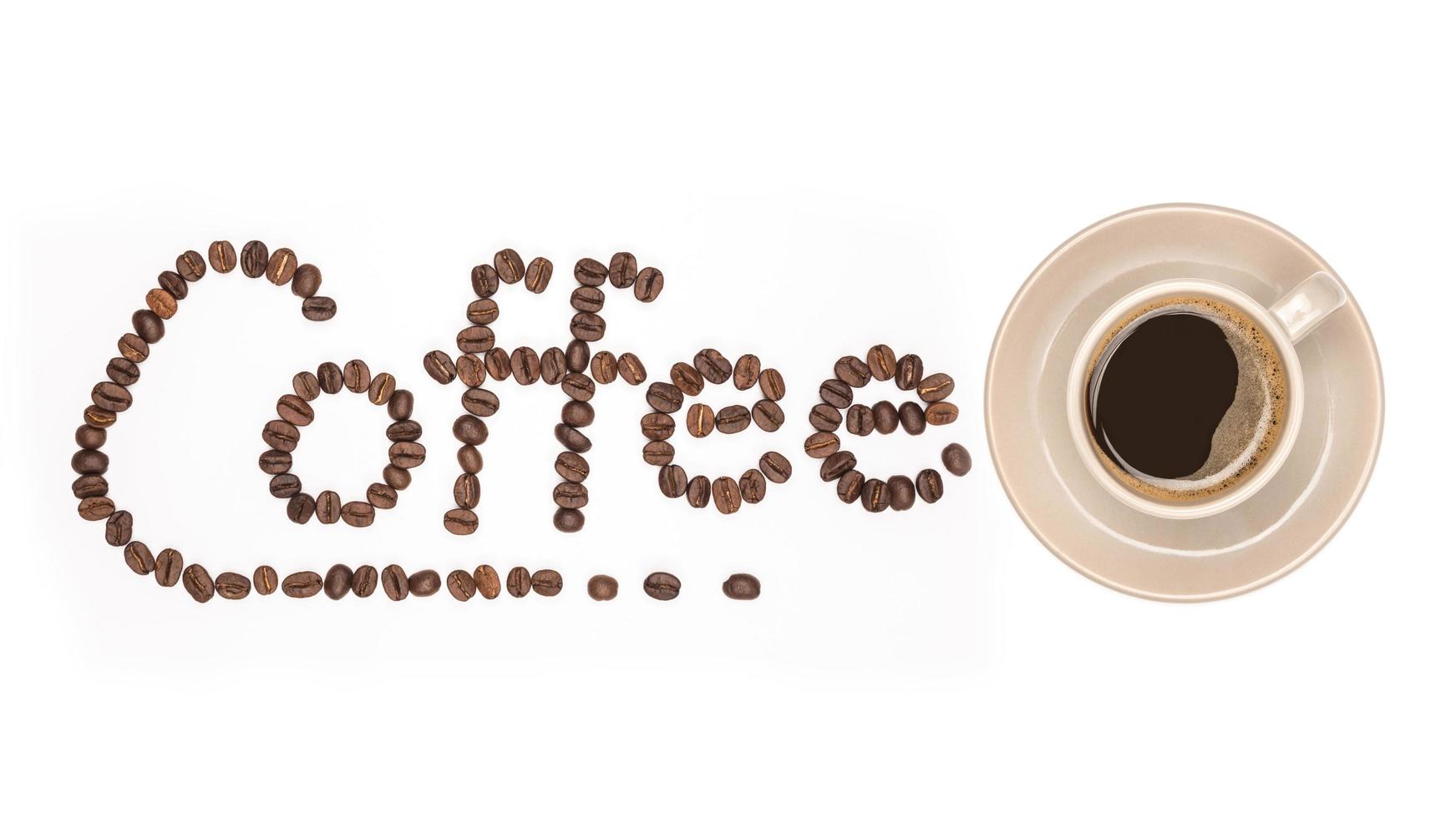 Coffee cup and Coffee beans spread with Font the word made of coffee beans isolated On a white background photo