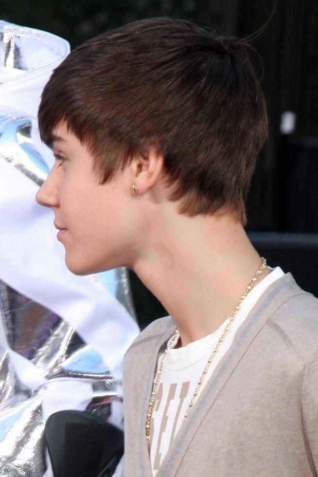 LOS ANGELES, JAN 26 - Justin Bieber at the Michael Jackson Immortalized Handprint and Footprint Ceremony at Graumans Chinese Theater on January 26, 2012 in Los Angeles, CA photo