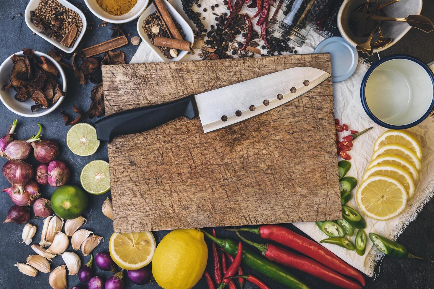 Healthy food herbs Spices for use as cooking ingredients on a wooden background with Fresh organic vegetables on wood. The concept of food ingredients with Variety on the rustic table. photo