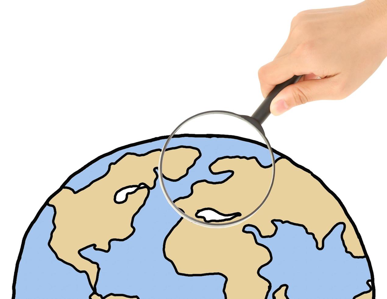 hand with magnifying glass over the globe isolated on white photo
