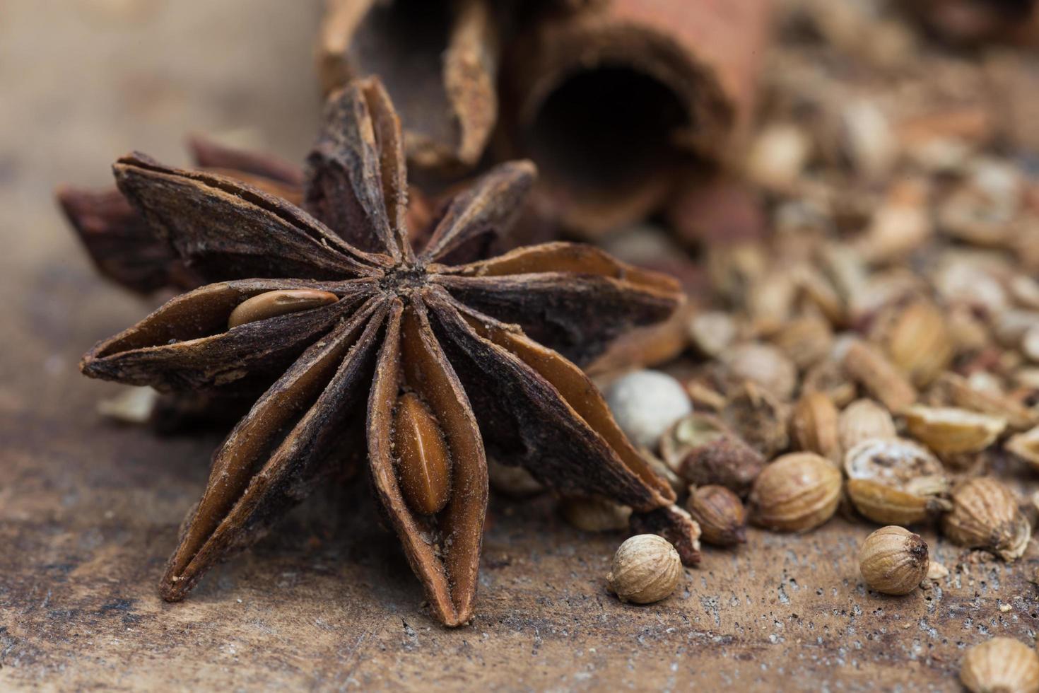 Spices lying on a wooden surface closeup photo