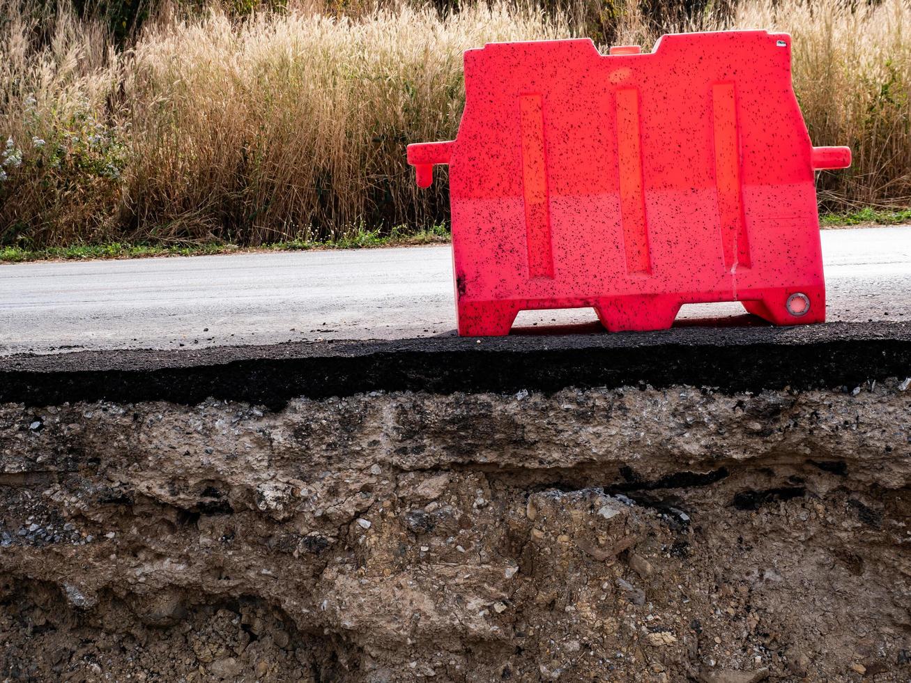 Close to rocky and sandy soils under paved roads photo