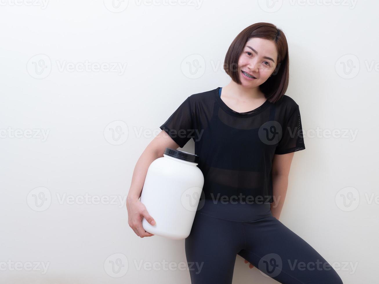 Sport woman with whey protein photo