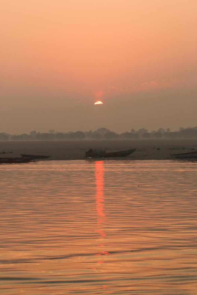 Sunrise on the Ganga river, Varanasi, India photo