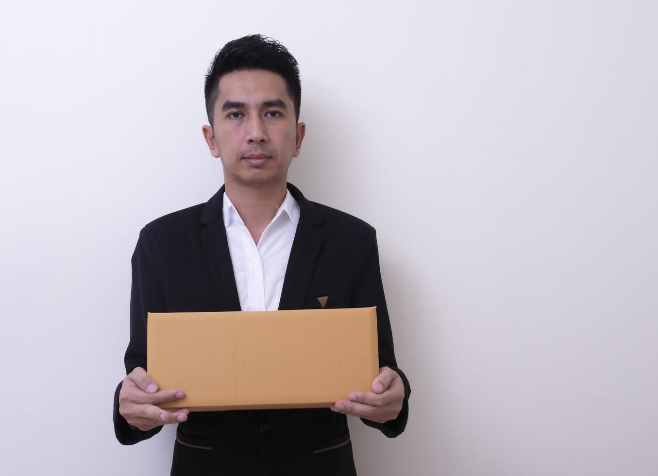 Shop assistant brings the parcel, isolated, white background photo