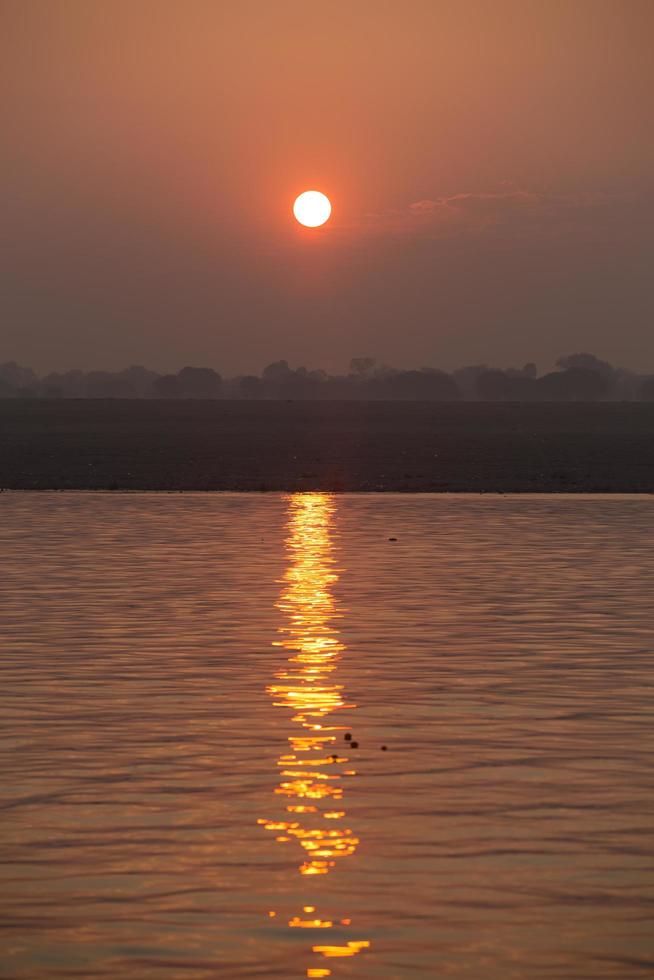 Sunrise on the Ganga river, Varanasi, India photo