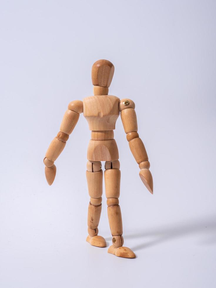 Wooden dummy isolated on white background photo