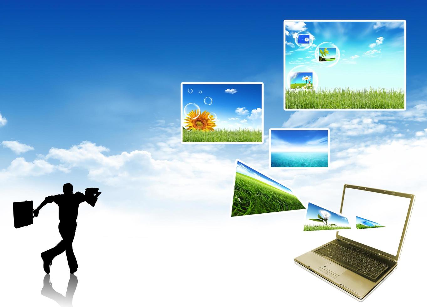 Multimedia concept with modern laptop on green field. photo