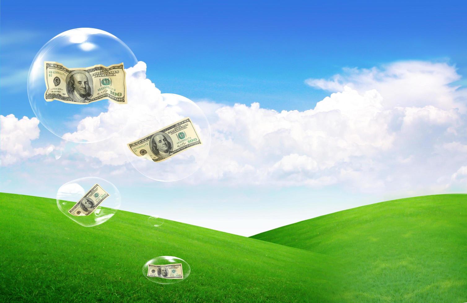 dollars falling on the bubbles from the sky photo