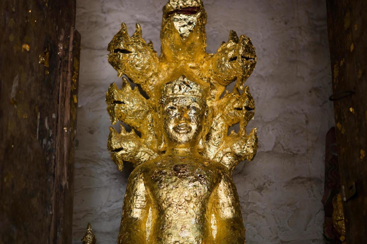 close up Buddha statue gilded in the measure photo