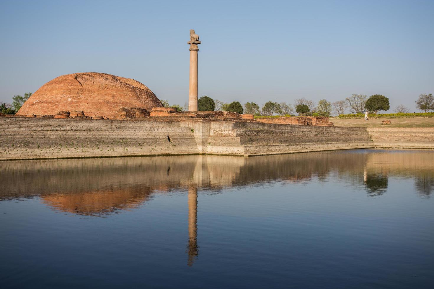 Ananda Stupa and Ashoka pillar photo