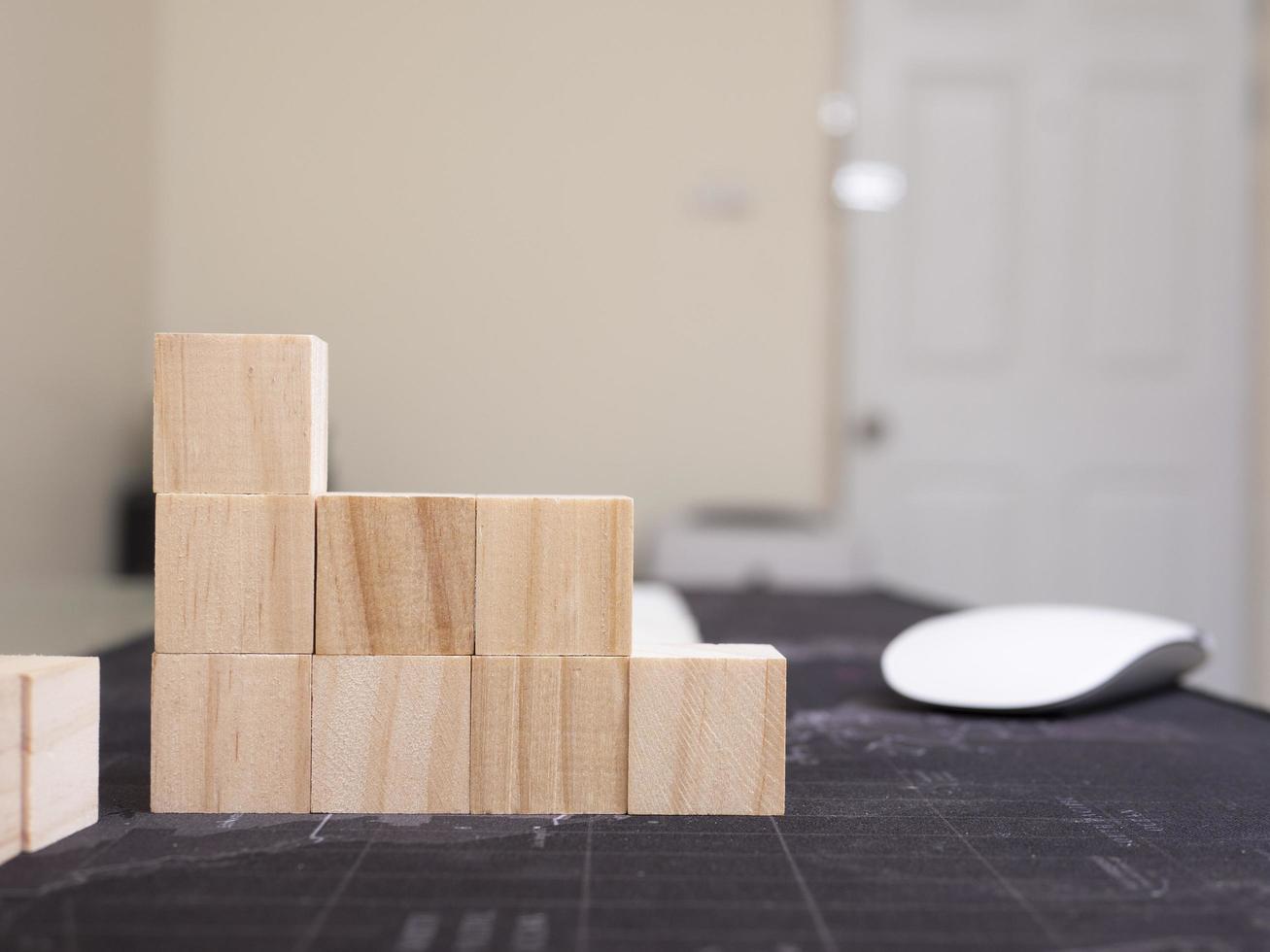 wood cube arrange in pyramid shape ,business concept photo