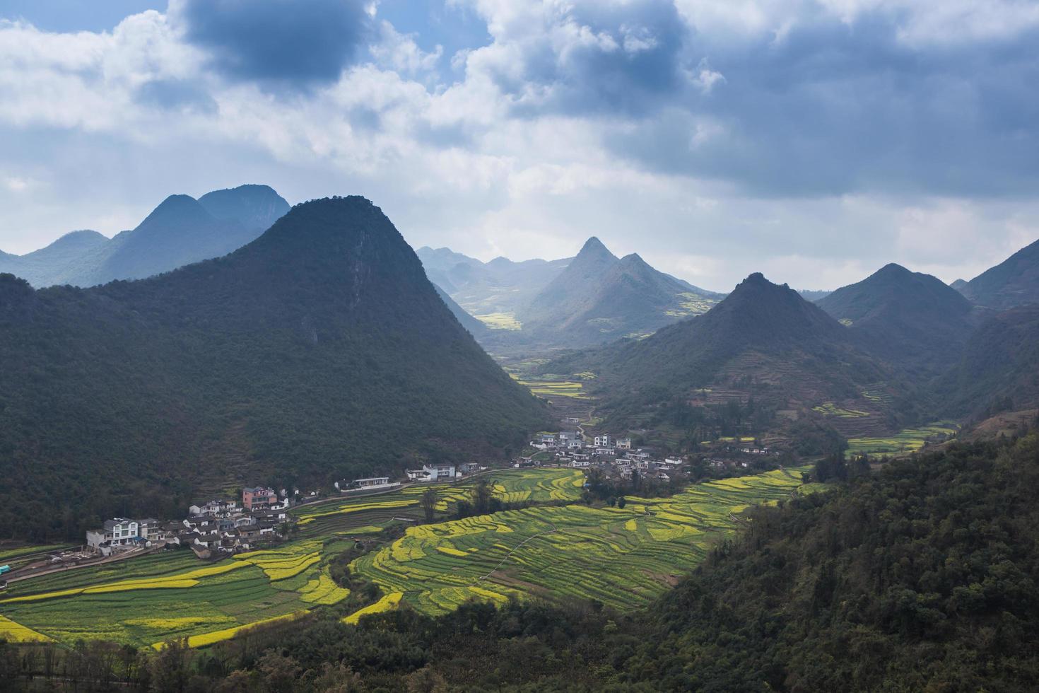 Spring fresh landscape of colorful fields, sunrise sky and beautiful hills valley photo