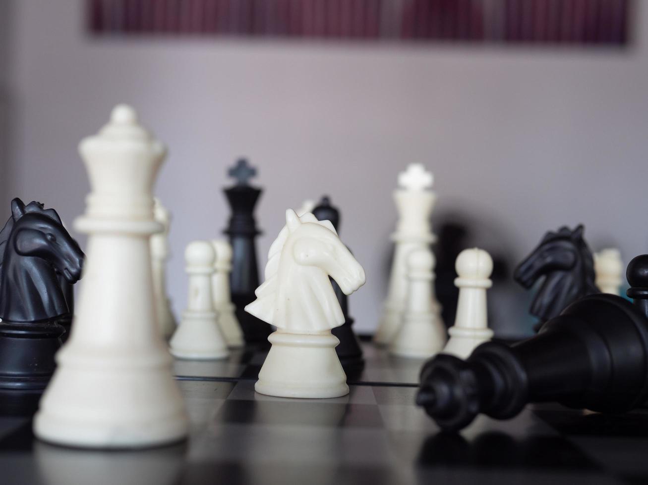 Chess board game with focus on black and white photo