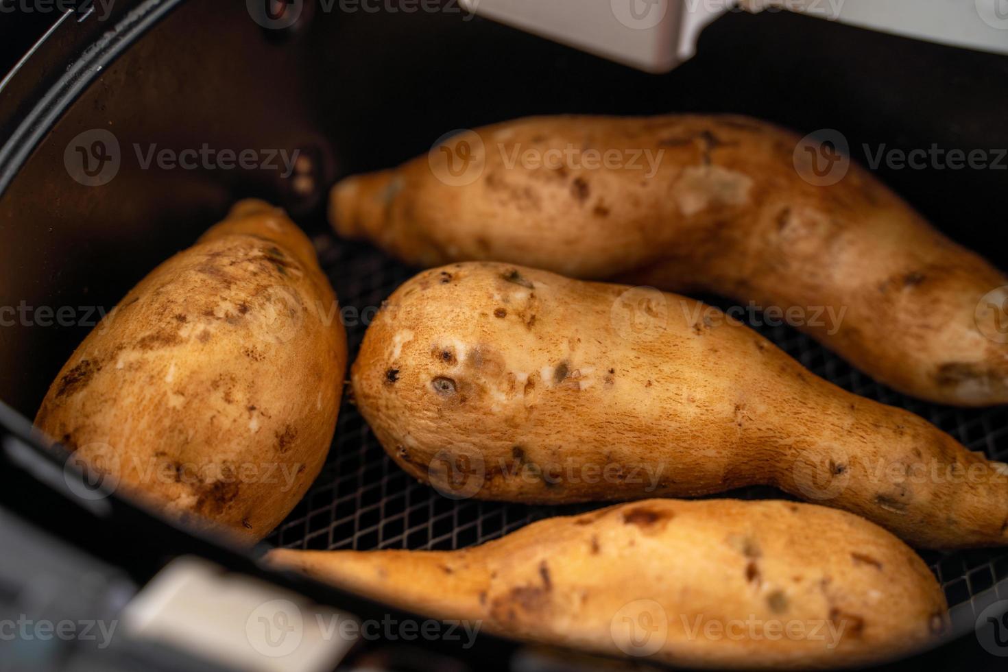 Roasted sweet potato cooked by airfryer at home. Healthy food for diet eating. photo
