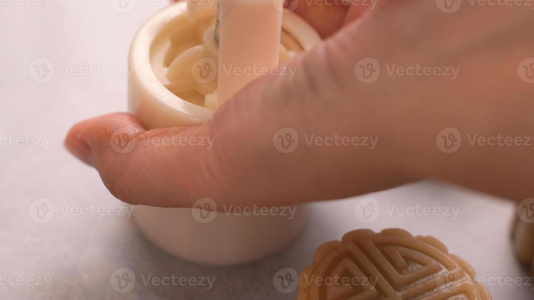 Homemade cantonese moon cake pastry on baking tray before baking for traditional festival, close up, lifestyle. photo